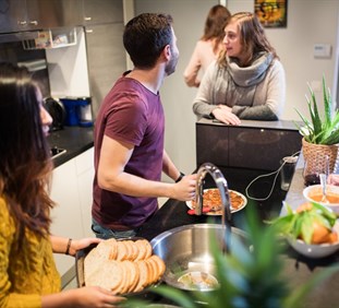 Students preparing food in kitchen